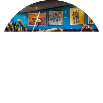 A vibrant cultural hall in South Sudan with traditional paintings