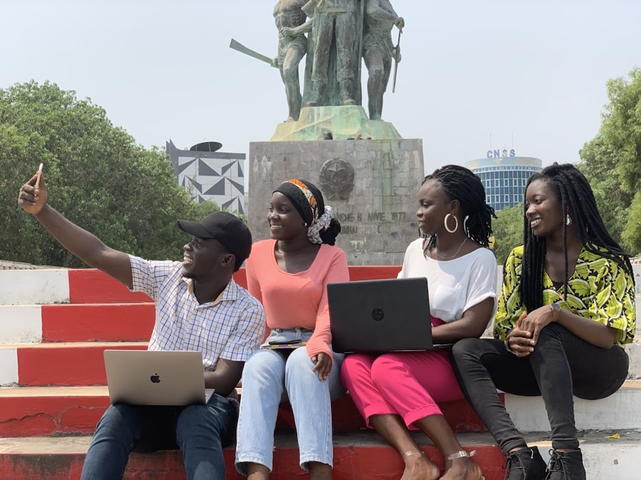 A team of university students sitting together with laptops